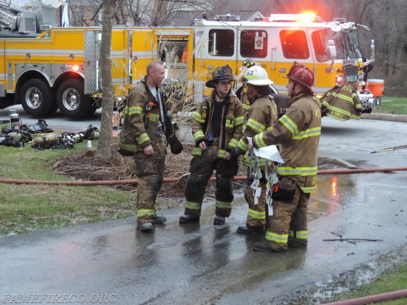 Ladder 53 crew regroups after working garage fire. 